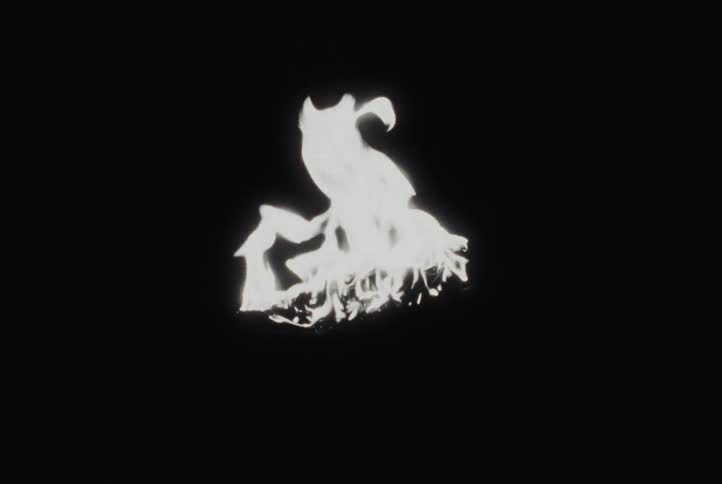 An isolated white fire burns and dances against a solid black background