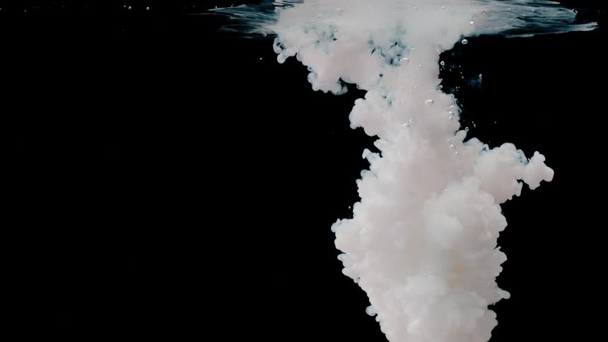 A white cloud bubbles and grows underwater