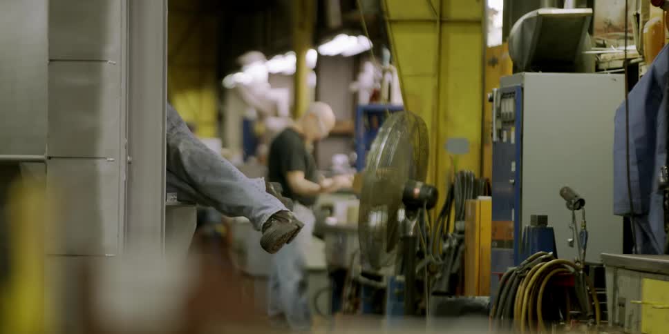 Two men working in a machine shop