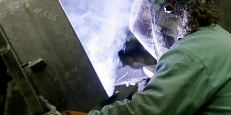 A person welds