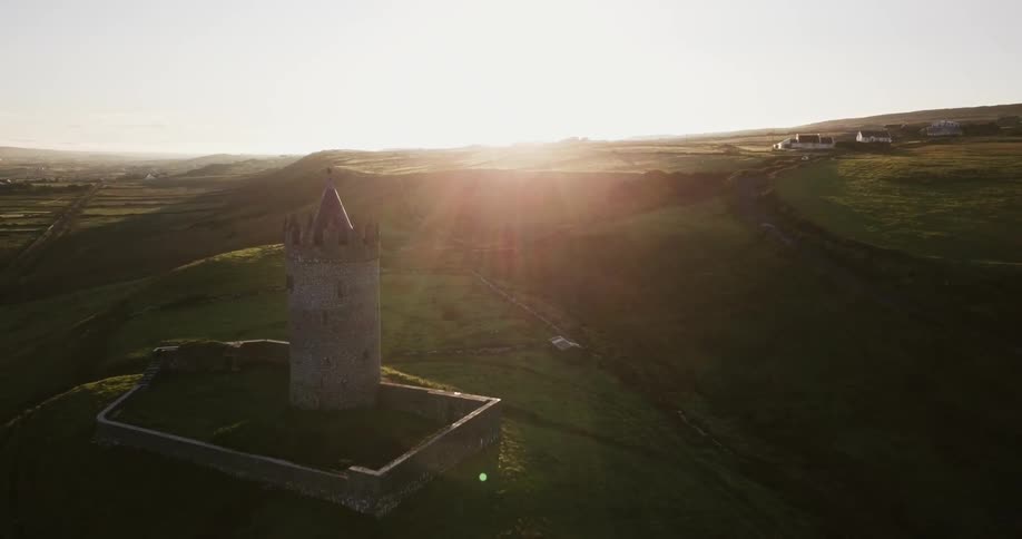 Sunlight shines down on a stone tower