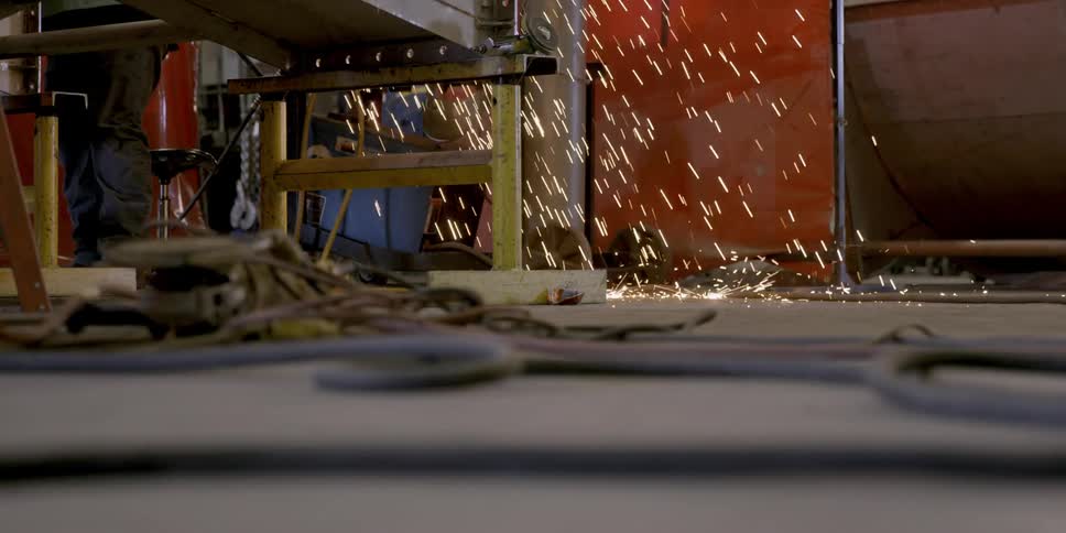 Sparks hit the floor of a factory