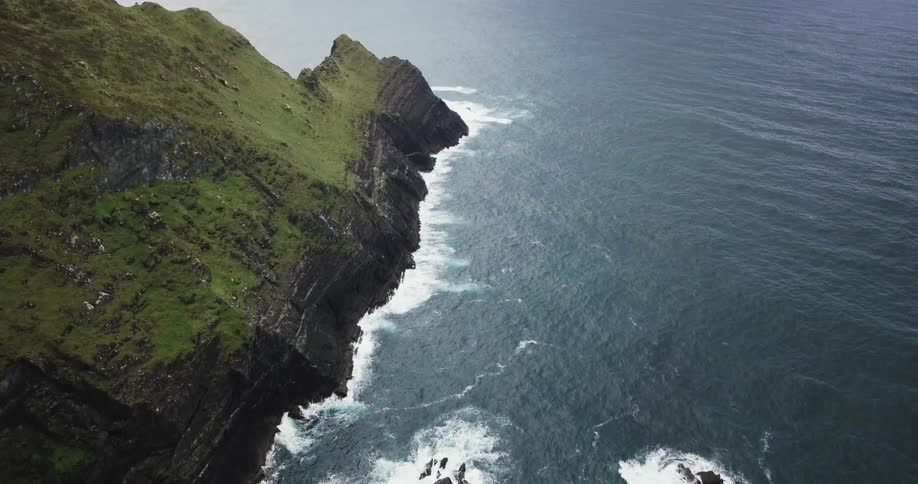 Ocean waves crash into a rocky shore