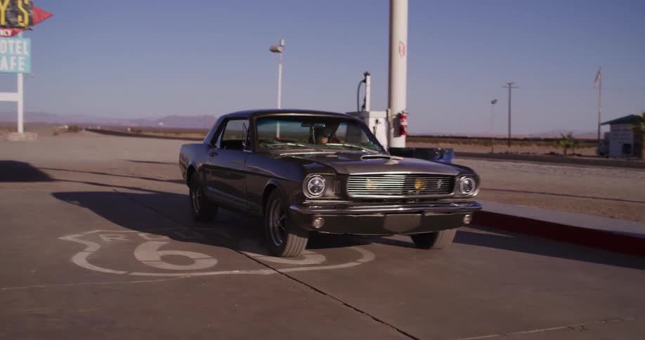 Classic American muscle car arrives at Roy's Motel and Cafe on the iconic Route 66