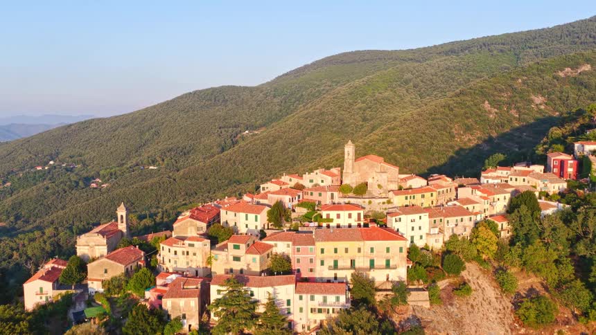 Aerial view of Marciana, a beautiful mountain village on the island of Elba, Italy, illuminated by the warm light of sunrise
