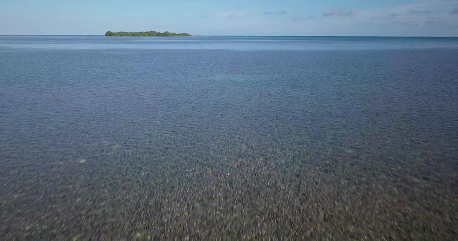 The water has many rocks below