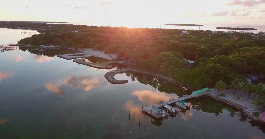 The water is very calm at sunrise