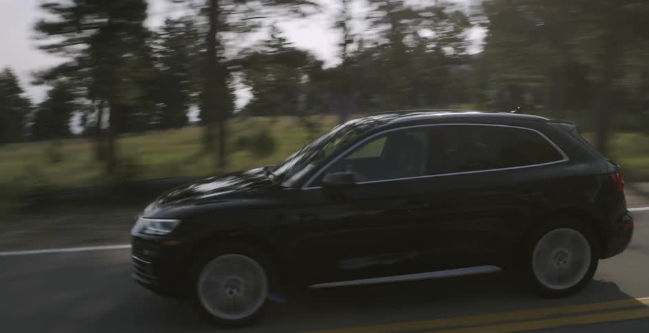 A car travels down the road