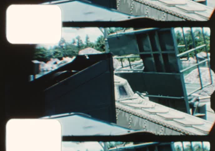 Vintage 8mm film captures the iconic submarine ride through a beautiful tropical lagoon at a theme park
