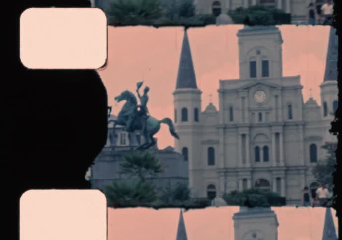 Vintage 1969 film captures the iconic Jackson Square in New Orleans, featuring the Andrew Jackson statue, St. Louis Cathedral, and visitors strolling through the park