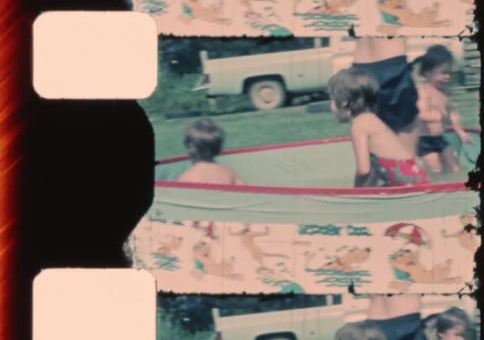 Authentic vintage footage captures the simple joy of children playing in a Scooby-Doo kiddie pool on a sunny summer day