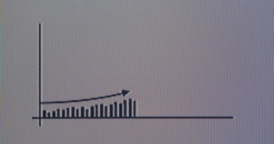 An animated bar graph on a digital screen shows a steady upward trend and exponential growth