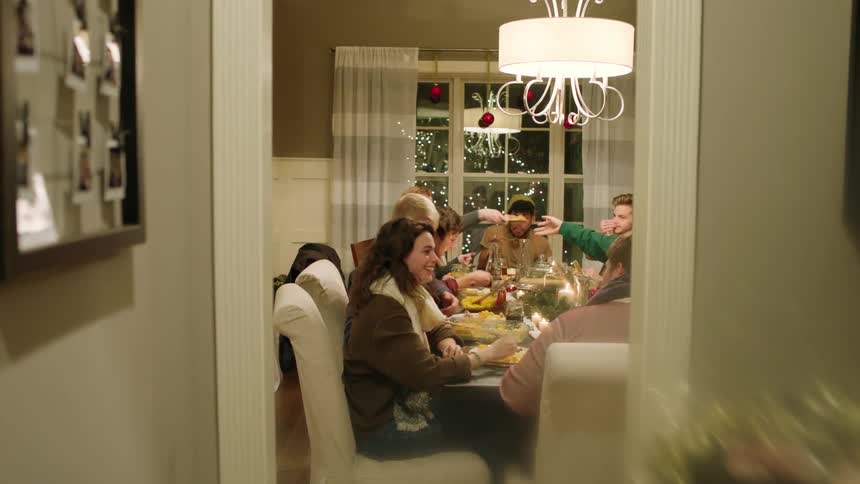 A family sits around a table for dinner