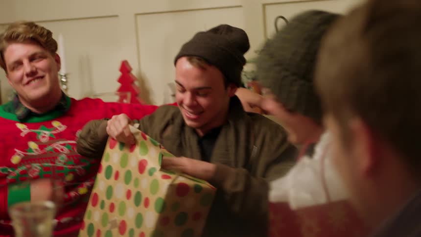 People open presents together and have fun