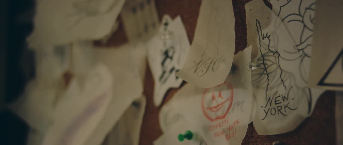 Paper and drawings pinned to a bulletin board