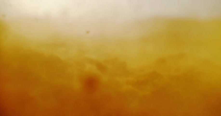 A close up view of the ground being disturbed and being kicked around