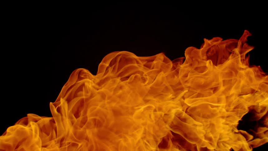 A flame billows and burns