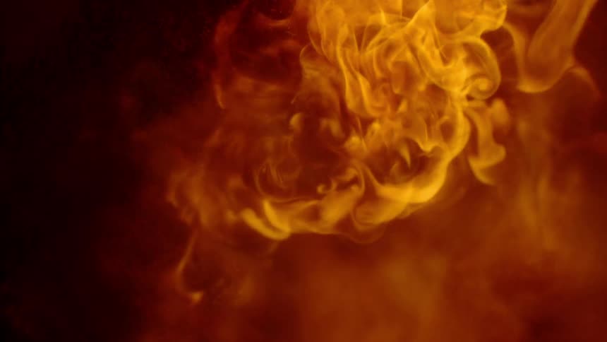 A flame billows and burns
