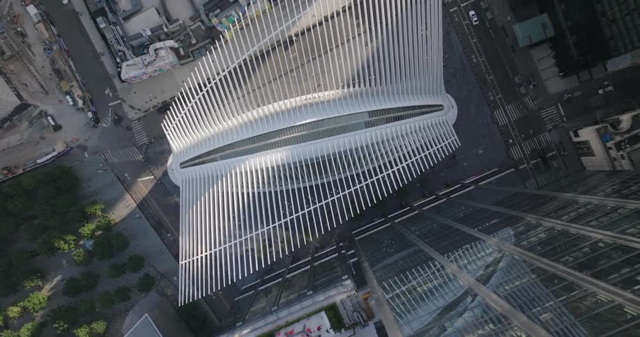An aerial top-down shot slowly ascends high above the iconic Oculus building at the World Trade Center in New York City