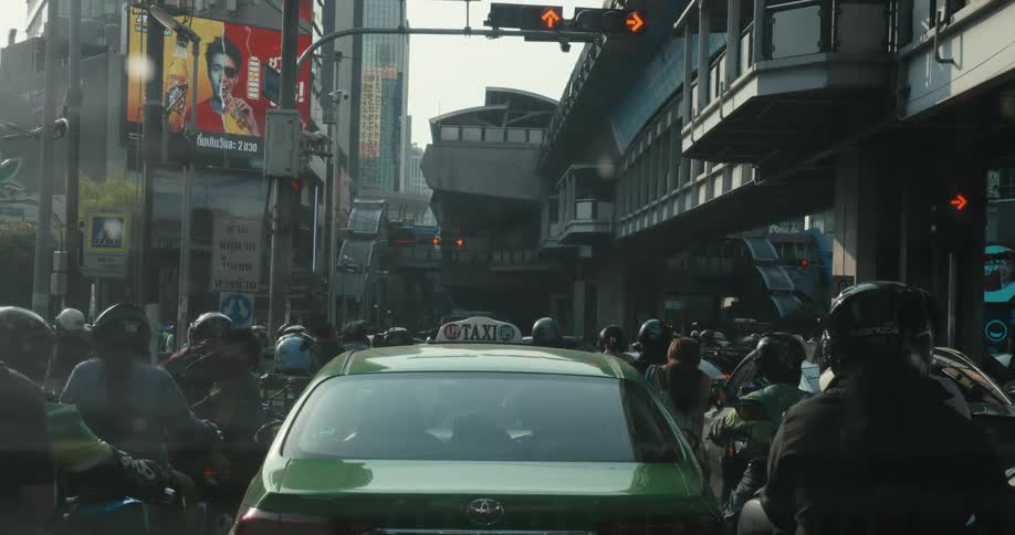 A green taxi cab is surrounded by motorcycles and sci-fi vehicles in a congested traffic jam in a futuristic cyberpunk city