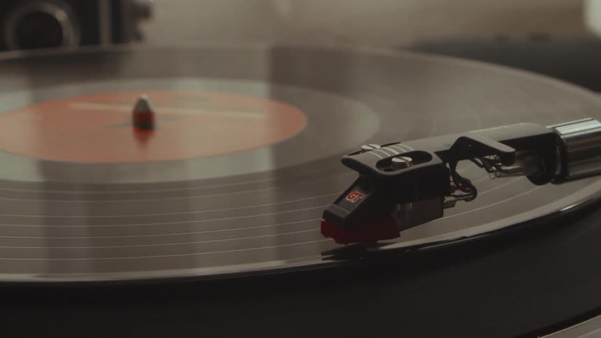 A classic vinyl record spins on a turntable as the stylus glides through the grooves