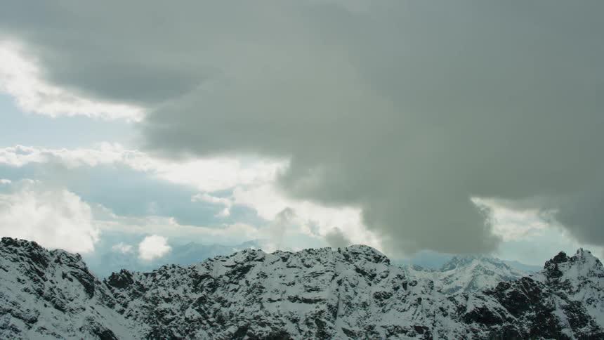 Snow covered mountains on a cloudy day