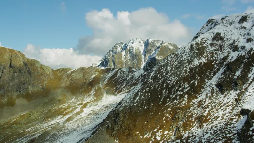 The mountain is high and with some snow on top