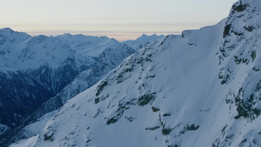 Moving view of a snow covered mountain
