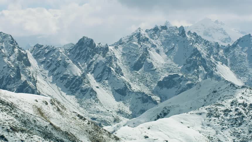 The mountains are high and covered with snow