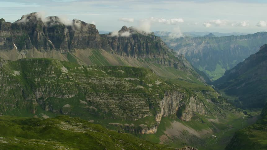 Green mountain range on cloudy day