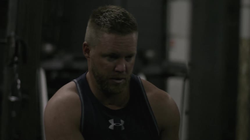 Man exercises in a gym