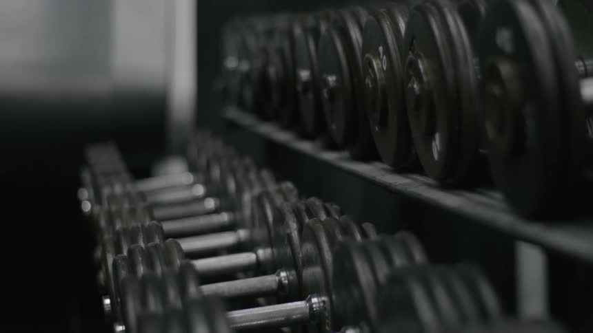 The stands are covered with different barbells
