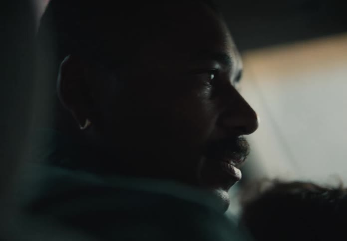 Intimate close-up of a father and his baby enjoying a quiet car ride together, with the focus shifting from the child to the man