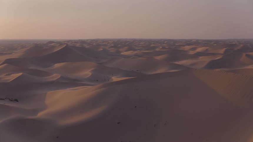 The tall sand dunes go out into the distance as far as can be seen