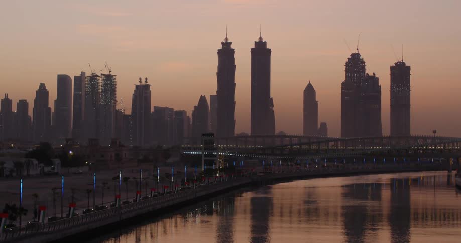 Across the water is a city with large buildings
