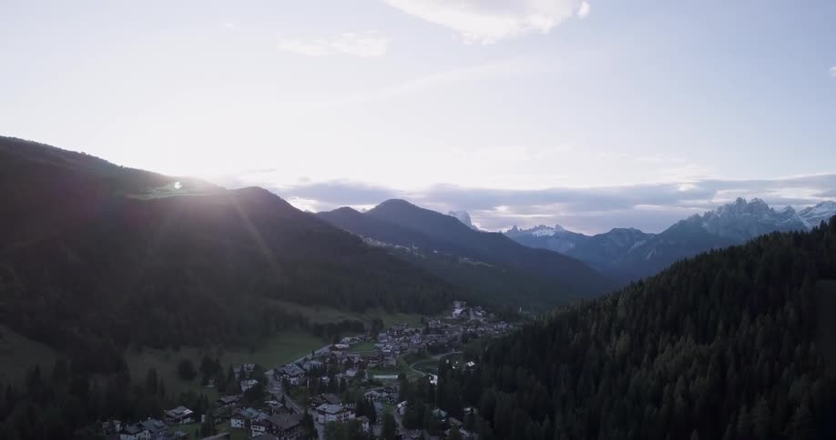A small town sits between mountains