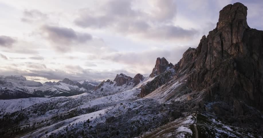 View of snowy mountains on a cloudy day