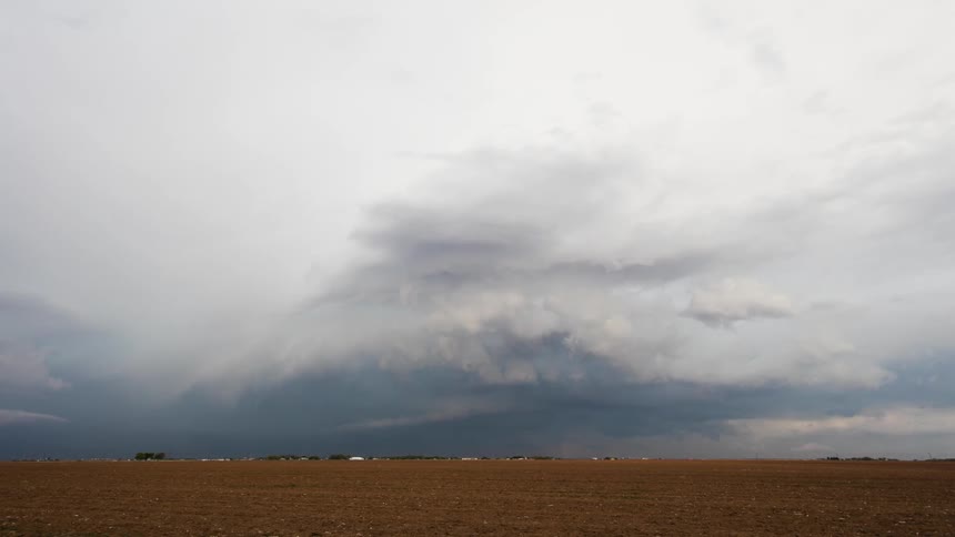 Clouds forming and flowing in sky while lightning flashes
