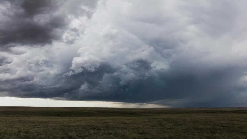 Time lapse of clouds rolling over plains