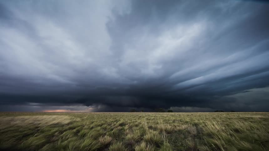 Time lapse of clouds rolling over plains