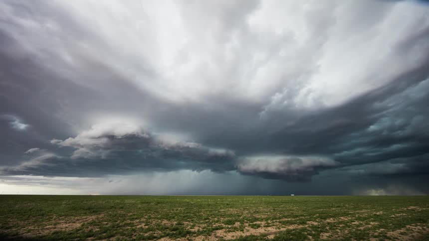 The clouds stir forming a storm over the field