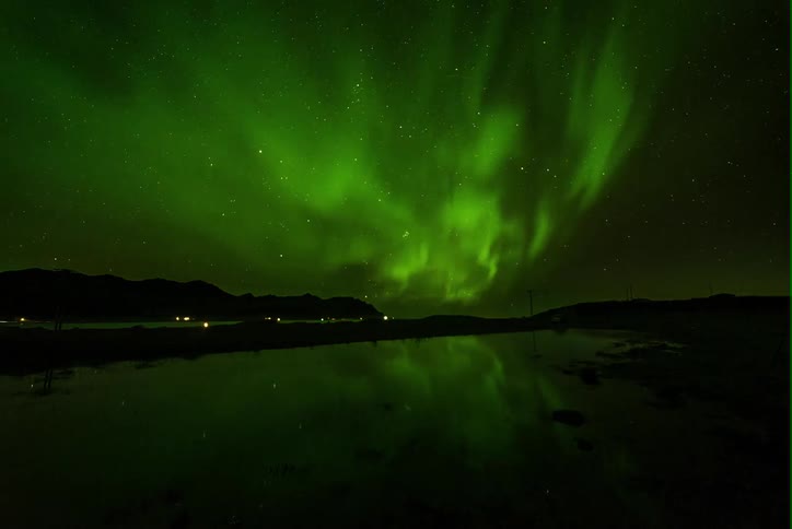 The aurora borealis lights up the sky