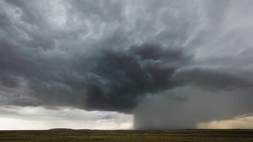 The storm clouds are swirling in the distance