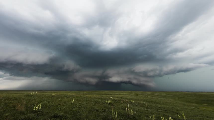 The clouds spin above the field