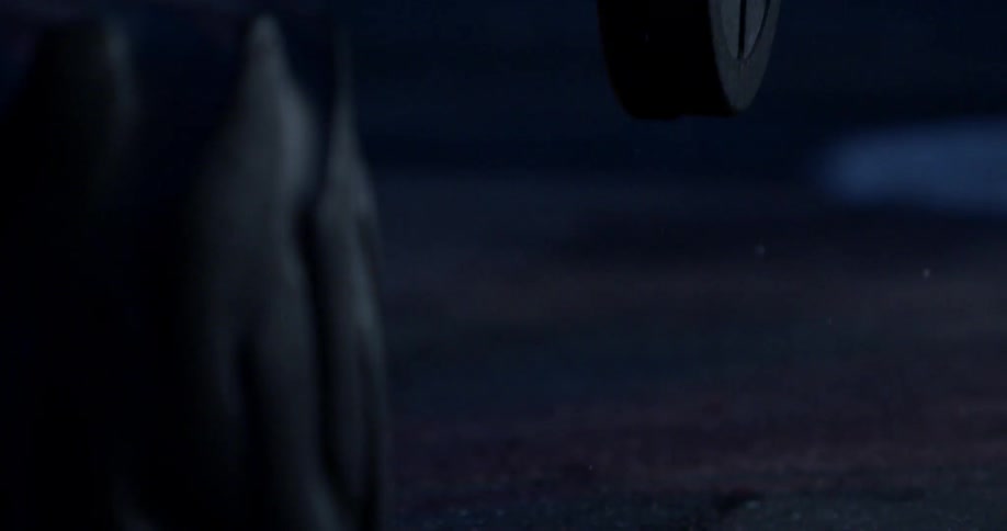 A barbell falls to the ground and bounces