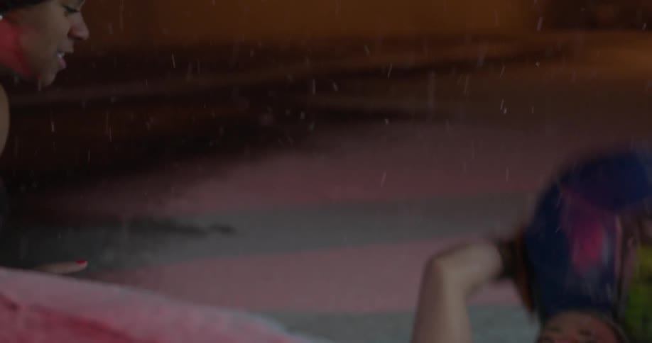 Two women are working out outside in the snow