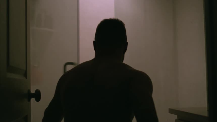 Man opens the door to a shower