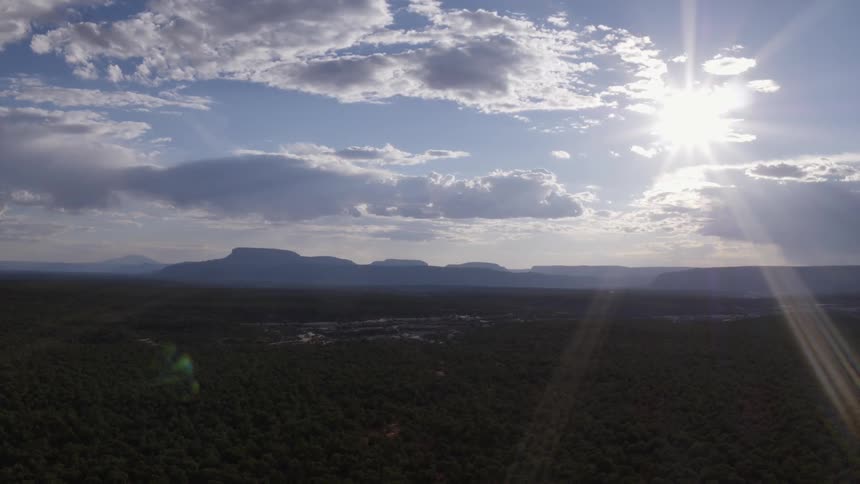 Sunlight shines down over a valley