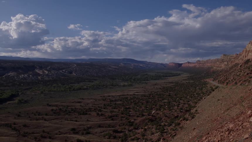 Clouds float over an open valley in the wilderness