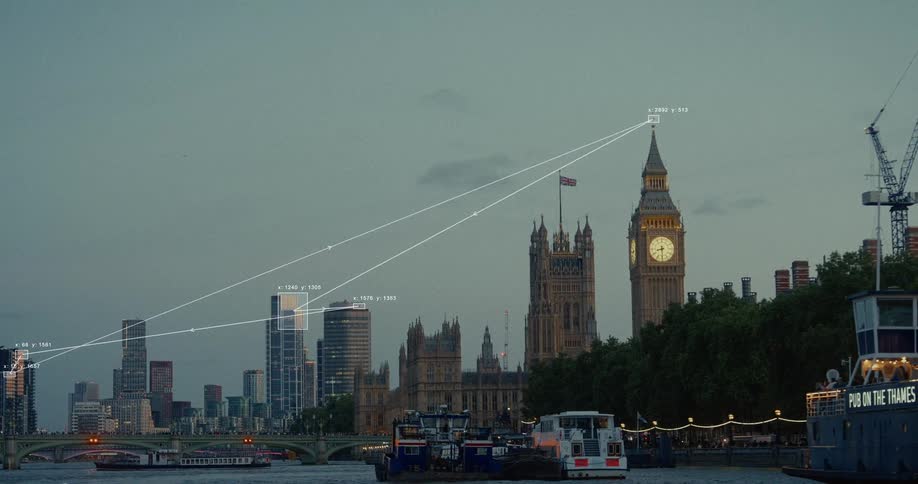 Futuristic animated graphics and data points track locations across the London skyline featuring Big Ben and the River Thames at dusk